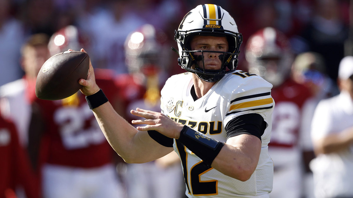Missouri Tigers quarterback Brady Cook (12) throws a pass against the Alabama Crimson Tide during the first half at Bryant-Denny Stadium.
