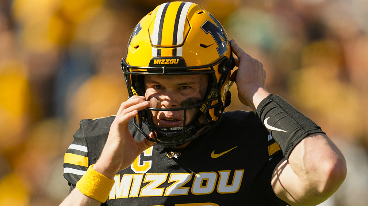Missouri Tigers quarterback Brady Cook (12) returns to the game during the second half against the Auburn Tigers at Faurot Field at Memorial Stadium.