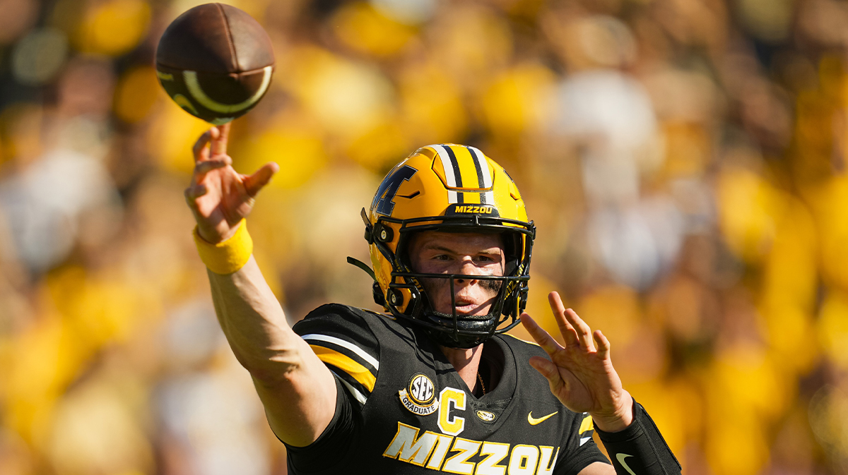 Missouri Tigers quarterback Brady Cook (12) throws a pass during the second half against the Auburn Tigers at Faurot Field at Memorial Stadium.