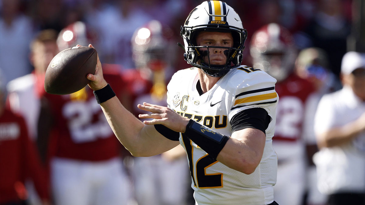 Missouri Tigers quarterback Brady Cook (12) throws a pass against the Alabama Crimson Tide during the first half at Bryant-Denny Stadium.