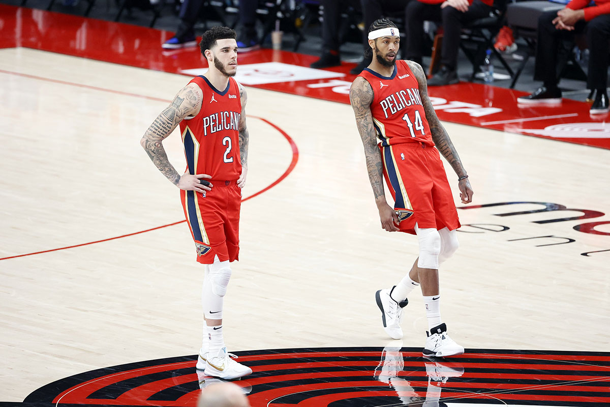 New Orleans Pelicans point guard Lonzo Ball (2) and small forward Brandon Ingram (14) watch a free throw attempt by Eric Bledsoe (not pictured) during the first half against the Portland Trail Blazers at Moda Center.