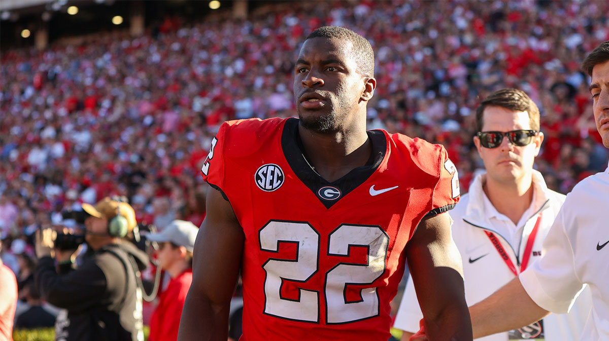 Georgia Bulldogs running back Branson Robinson (22) leaves with an injury against the Mississippi State Bulldogs in the second quarter at Sanford Stadium.