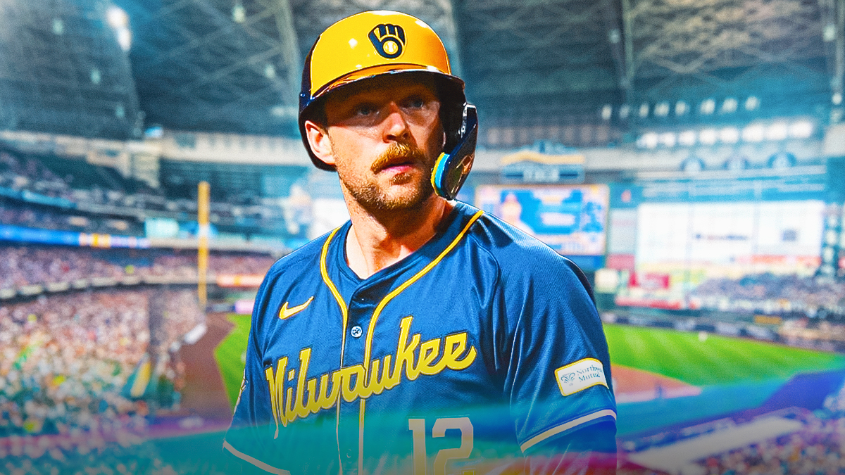 Rhys Hoskins in a Milwaukee Brewers uniform looking determined as he talks about winning the next wild card game and avoiding another brewers playoff loss.