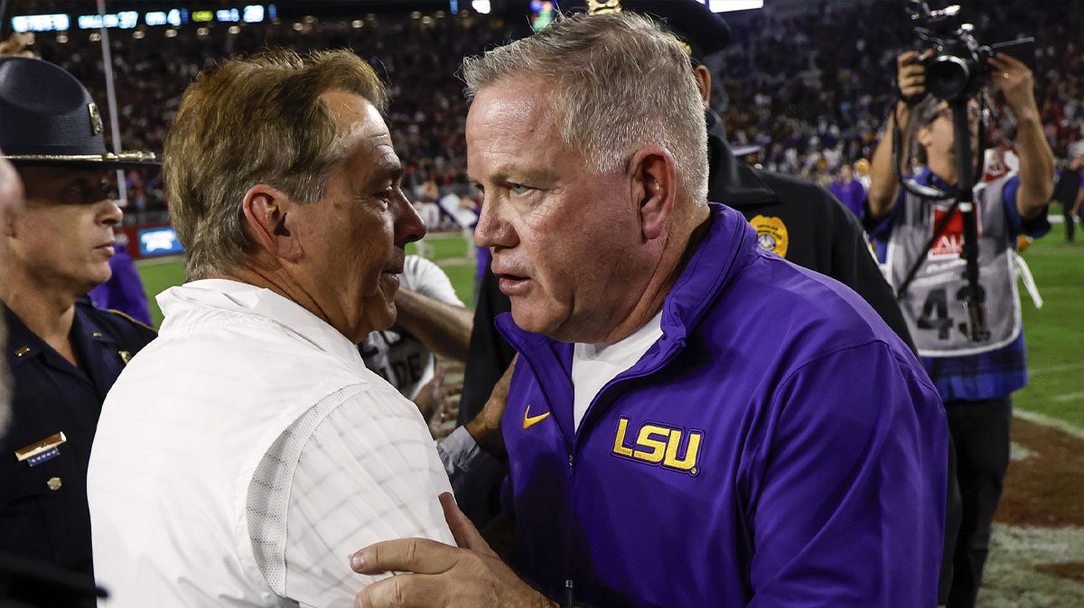 Alabama Crimson Tide head coach Nick Saban talks with LSU Tigers head coach Brian Kelly after the second half at Bryant-Denny Stadium.