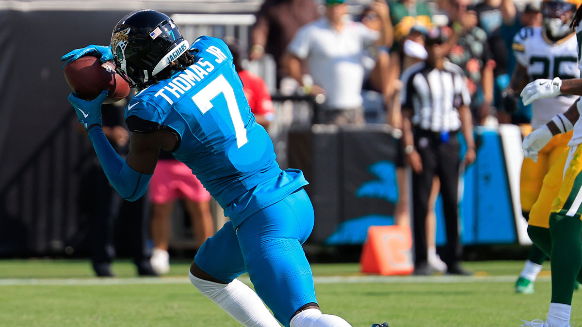 Jacksonville Jaguars wide receiver Brian Thomas Jr. (7) corrals the ball for a touchdown score during the third quarter of an NFL football matchup Sunday, Oct. 27, 2024 at EverBank Stadium in Jacksonville, Fla. The Packers edged the Jaguars 30-27 on a last-second field goal.