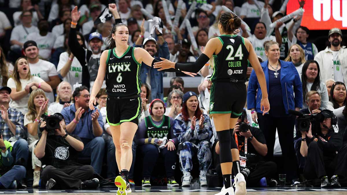 Minnesota Lynx forward Bridget Carleton (6) and forward Napheesa Collier (24) celebrates during the first half of game three of the 2024 NBA Finals against the New York Liberty at Target Center.