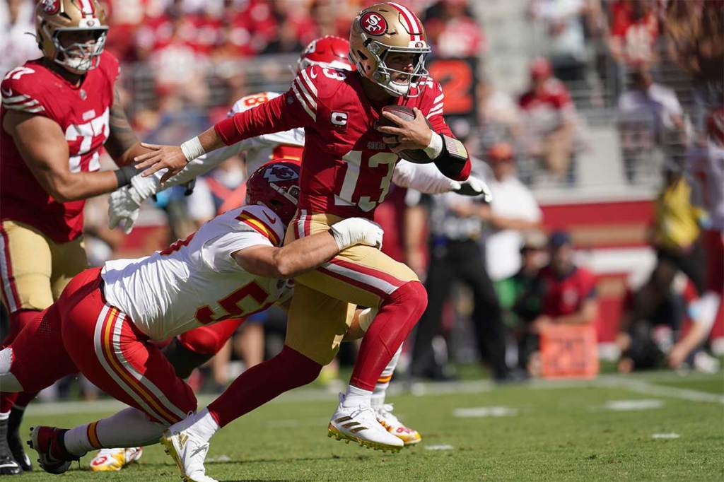 San Francisco 49ers quarterback Brock Purdy (13) is tackled by Kansas City Chiefs defensive end George Karlaftis (56) in the first quarter at Levi's Stadium.
