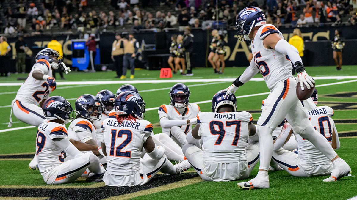 Denver Broncos linebacker Cody Barton (55), right, celebrates running back an interception for a touchdown against New Orleans Saints quarterback Spencer Rattler with a duck, duck, goose celebration with his teammates during the fourth quarter at Caesars Superdome.
