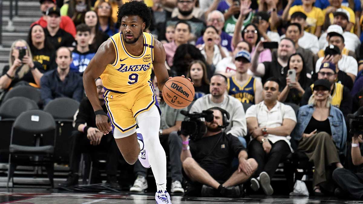 Los Angeles Lakers guard Bronny James (9) dribbles the ball up the court against the Golden State Warriors in the fourth quarter of their preseason game at T-Mobile Arena.