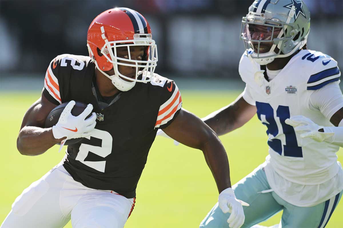 Cleveland Browns wide receiver Amari Cooper (2) runs with the ball after a catch as Dallas Cowboys cornerback Caelen Carson (21) defends during the first quarter at Huntington Bank Field