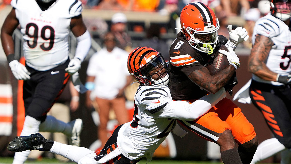 Cincinnati Bengals cornerback Josh Newton (28) tackles Cleveland Browns wide receiver Elijah Moore (8) in the 3rd quarter at Huntington Bank Field in Cleveland October 20, 2024. The Bengals won 21-14.