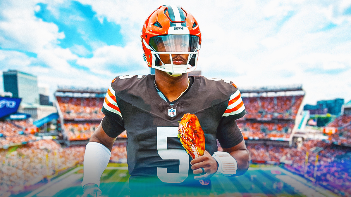 Jameis Winston holding a chicken leg in front of the Browns stadium