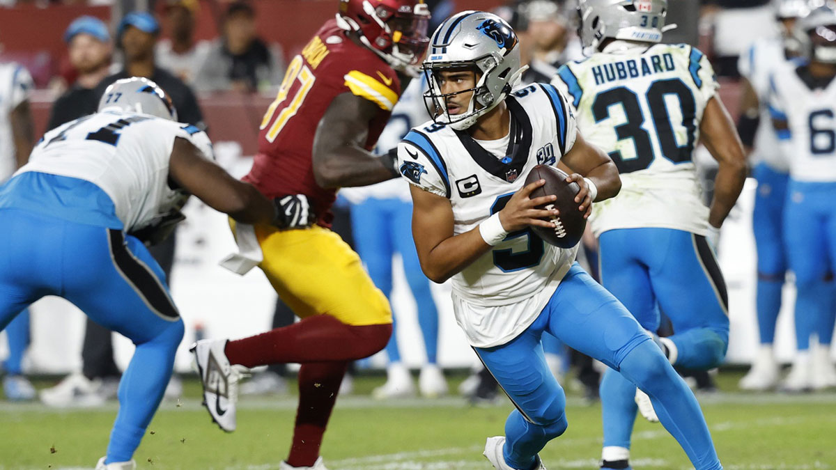 Carolina Panthers quarterback Bryce Young (9) scrambles against the Washington Commanders during the fourth quarter at Northwest Stadium.