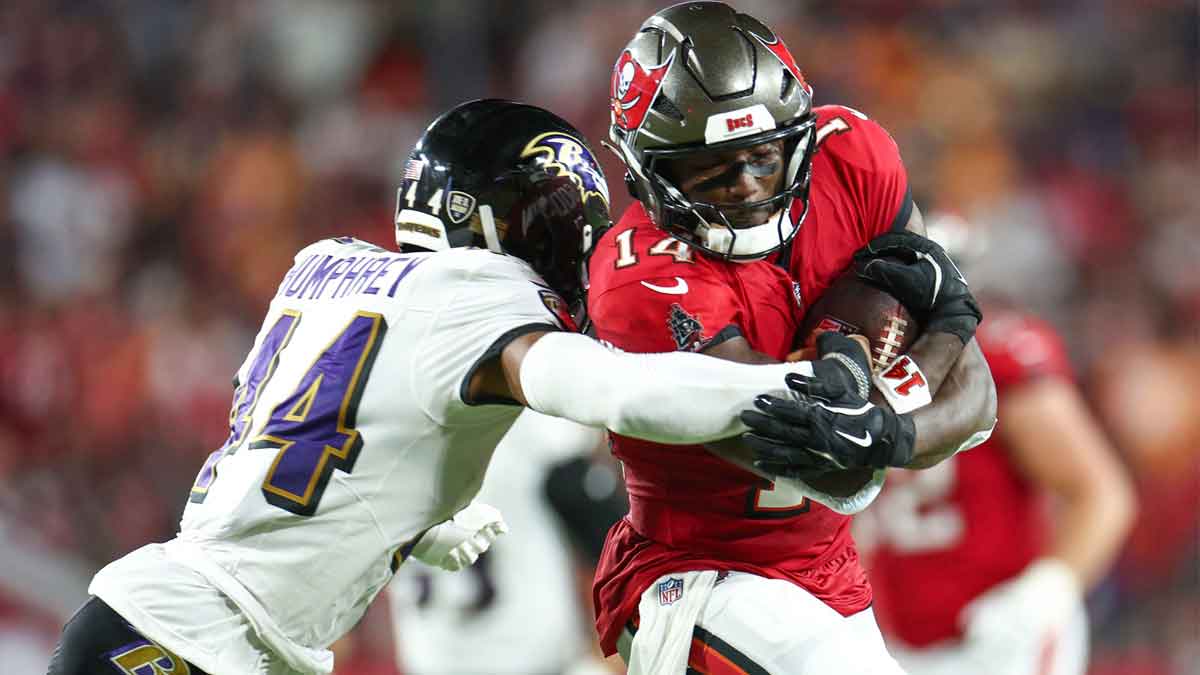 Tampa Bay Buccaneers wide receiver Chris Godwin (14) is pressured by Baltimore Ravens cornerback Marlon Humphrey (44) in the second quarter at Raymond James Stadium.