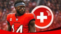 Image: Chris Godwin (Buccaneers) looking serious with medical cross symbol in the background