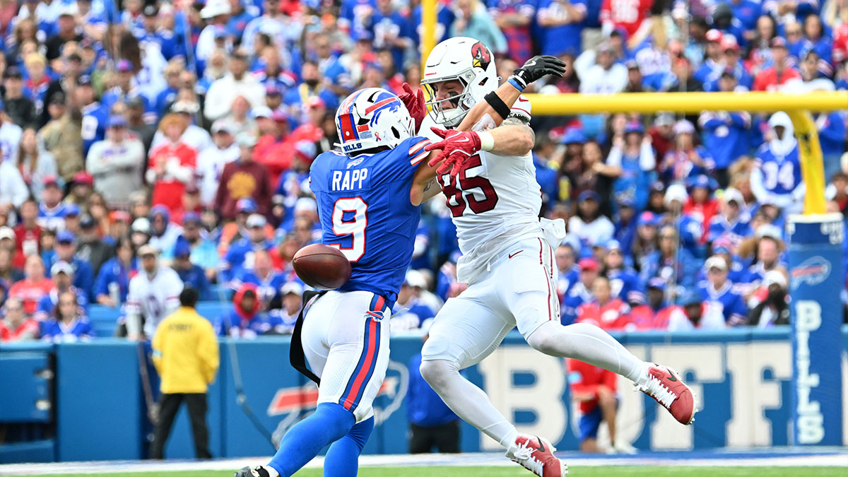 Buffalo Bills safety Taylor Rapp (9) breaks up a pass intended for Arizona Cardinals tight end Trey McBride (85) in the third quarter at Highmark Stadium.