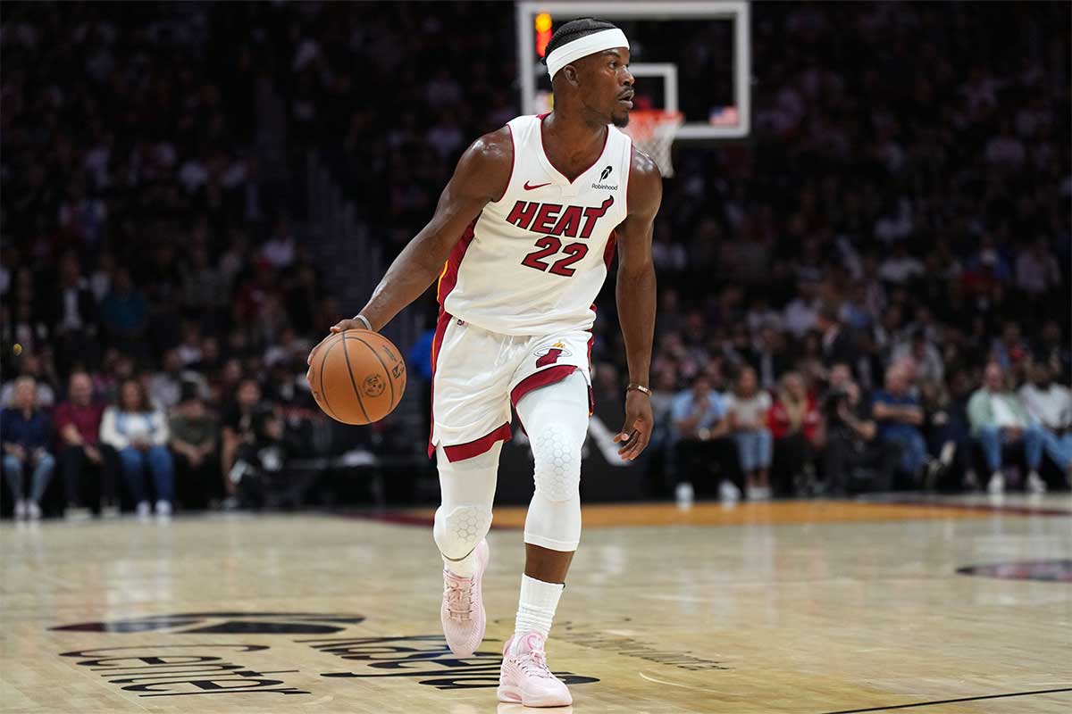 Miami Heat forward Jimmy Butler (22) brings the ball up the court against the Orlando Magic during the first half at Kaseya Center.