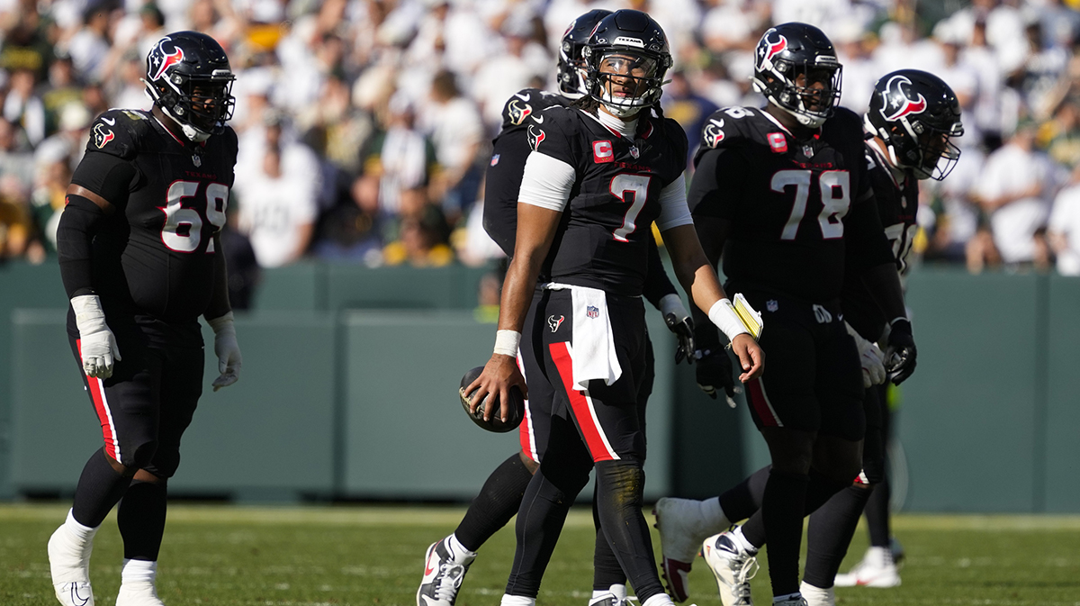Houston Texans quarterback C.J. Stroud (7) walks from the field during the third quarter against the Green Bay Packers at Lambeau Field.