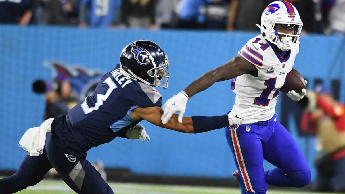 Oct 18, 2021; Nashville, Tennessee, USA; Buffalo Bills wide receiver Stefon Diggs (14) and Tennessee Titans cornerback Caleb Farley (3) during the first half at Nissan Stadium.