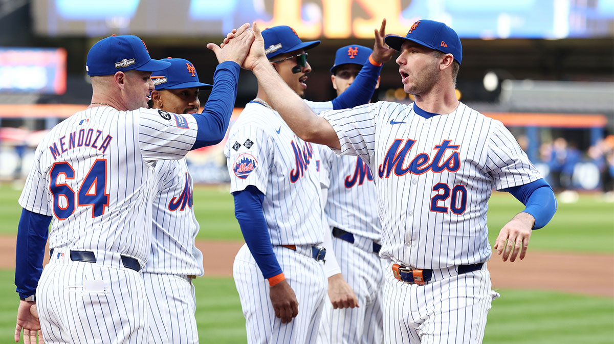 New York Mets first baseman Pete Alonso (20) greets manager Carlos Mendoza (64) before game three against the Philadelphia Phillies in the NLDS for the 2024 MLB Playoffs at Citi Field.
