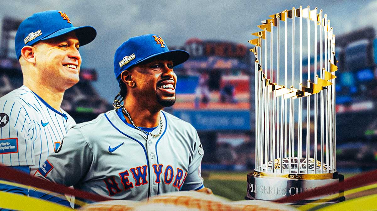 Mets’ Manager Carlos Mendoza standing next to Francisco Lindor with eyes on the World Series trophy