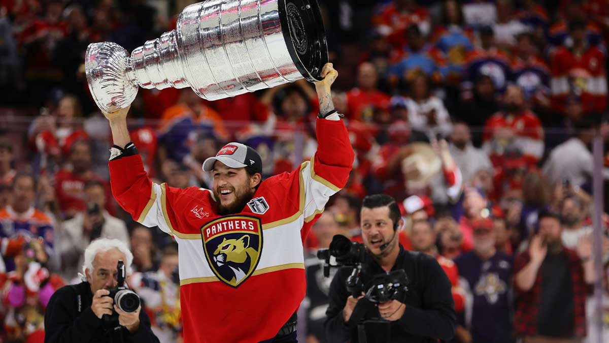 Florida Panthers forward Carter Verhaeghe (23) hoists the Stanley Cup after defeating the Edmonton Oilers in game seven of the 2024 Stanley Cup Final at Amerant Bank Arena.
