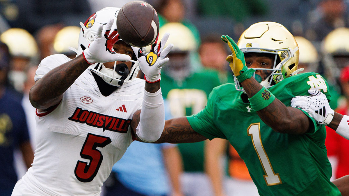 Notre Dame safety Jordan Clark (1) disrupts a catch and tackles Louisville wide receiver Caullin Lacy (5) during a NCAA college football game between Notre Dame and Louisville at Notre Dame Stadium on Saturday, Sept. 28, 2024, in South Bend.