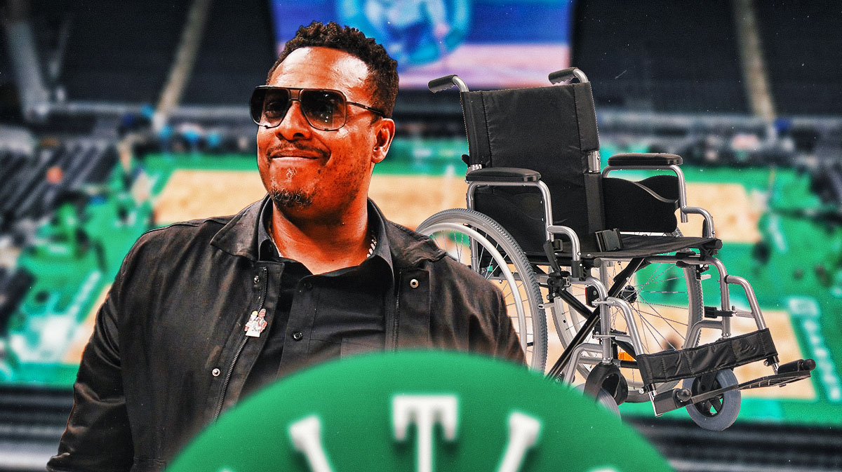 Paul Pierce with a wheelchair next to him.