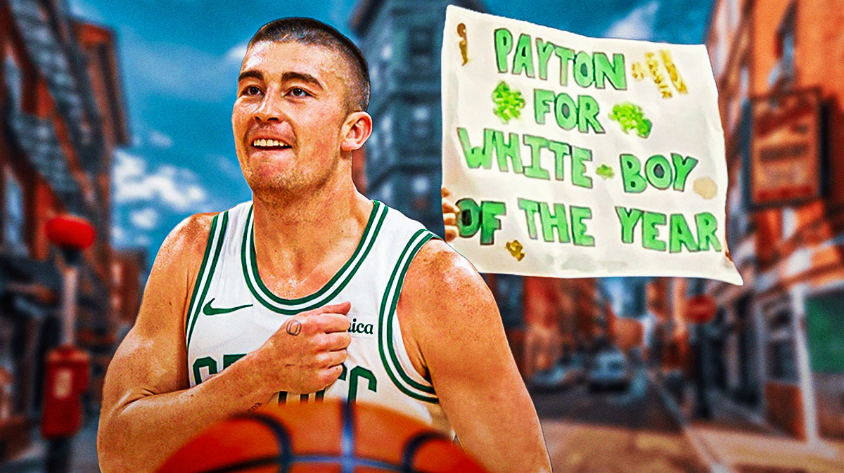 Celtics point guard Payton Pritchard looking at a fan holding up a sign.