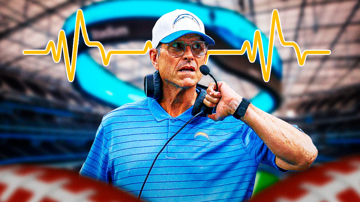 Los Angeles Chargers head coach Jim Harbaugh with a heart rhythm behind him