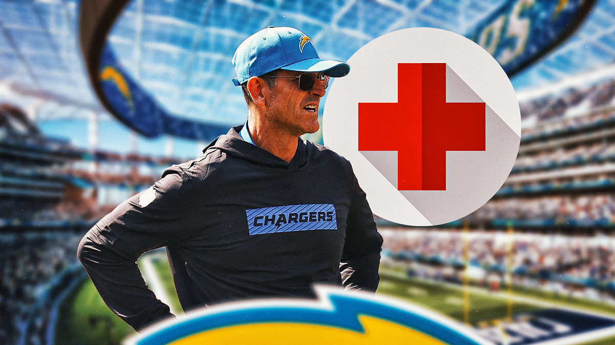 Jim Harbaugh in Chargers gear with medical Red Cross symbol next to him
