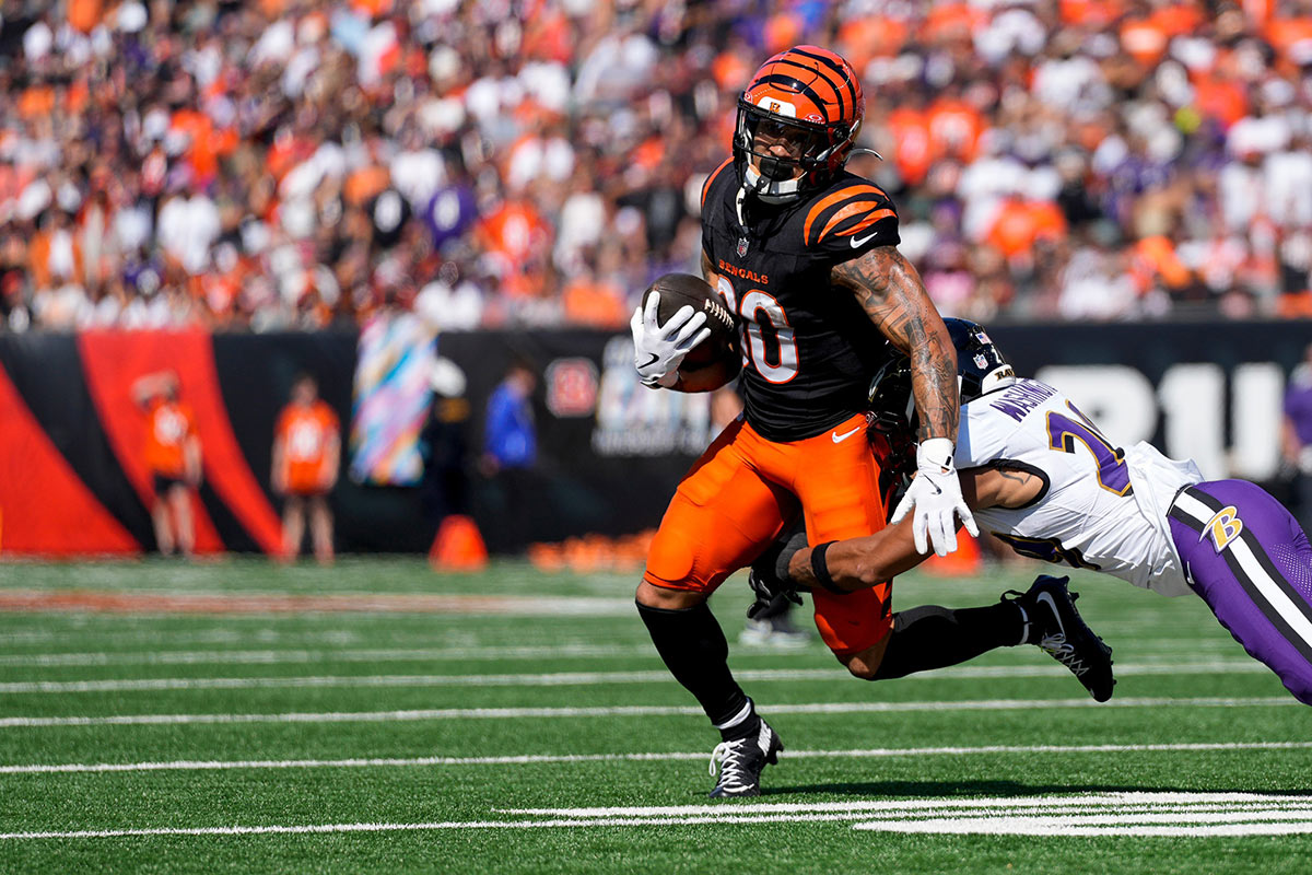 Cincinnati Bengals halfback Chase Brown (30) runs the ball in the second quarter of the NFL Week 5 game between the Cincinnati Bengals and Baltimore Ravens at Paycor Stadium in downtown Cincinnati on Sunday, Oct. 6, 2024. The Bengals led 17-14 at halftime.