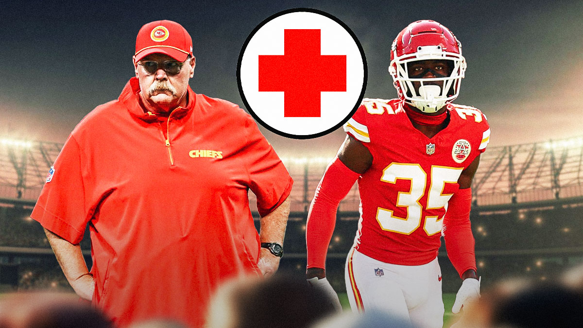 Chiefs corner back Jaylen Watson next the Chiefs logo