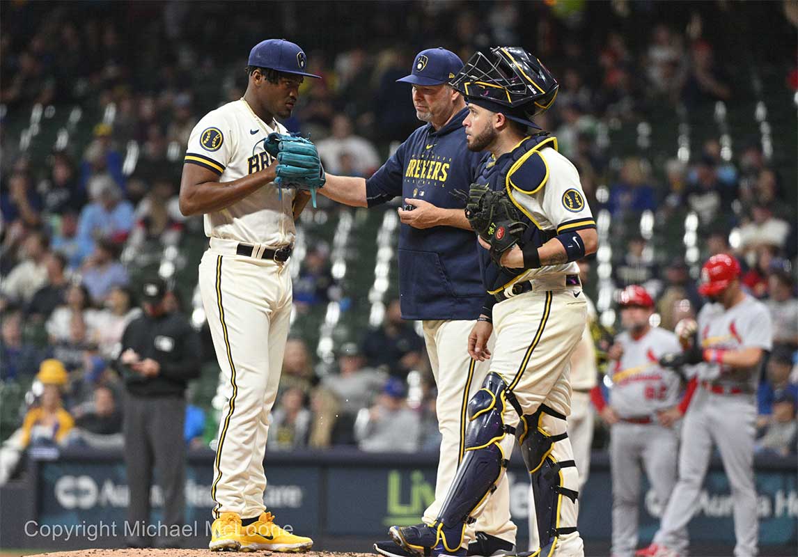 Milwaukee Brewers pitching coach Chris Hook (84) comes out to have a talk with Milwaukee Brewers relief pitcher Abner Uribe (45) in th sixth inning against the St. Louis Cardinals at American Family Field.