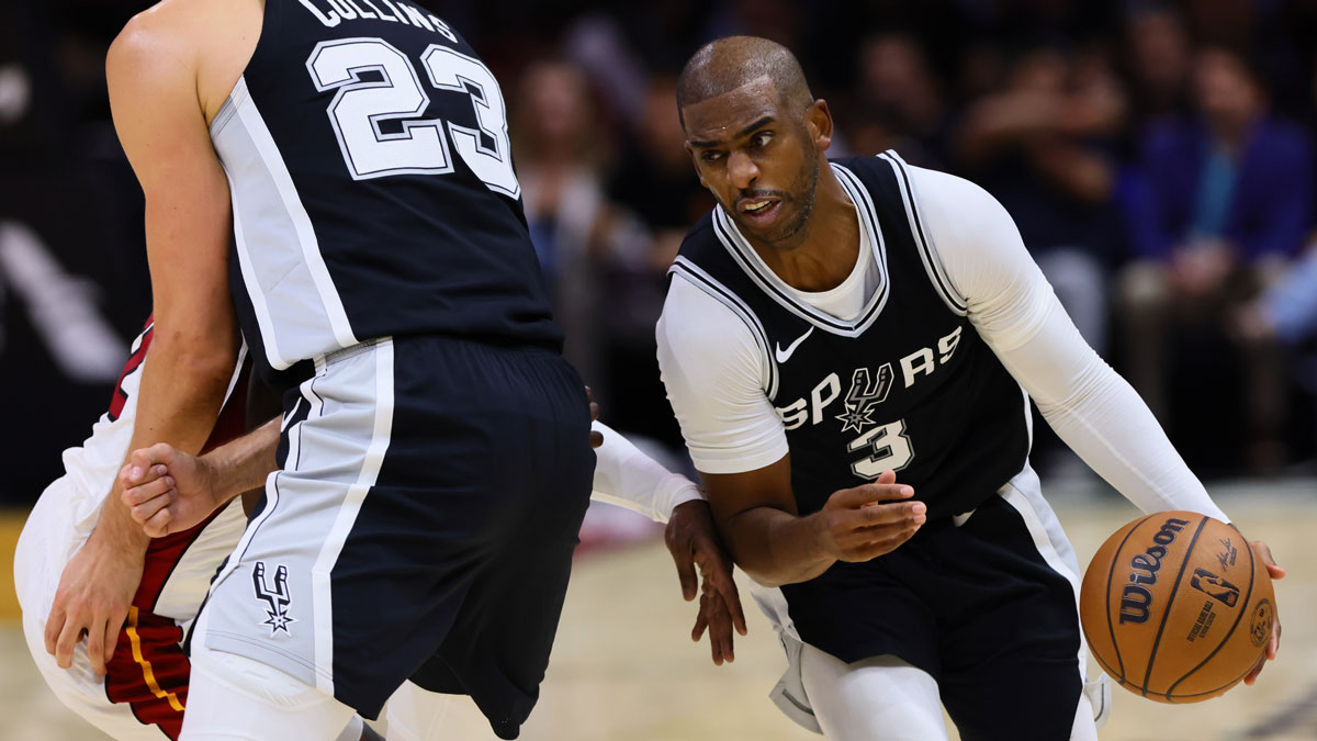 San Antonio Spurs guard Chris Paul (3) drives to the basketball against the Miami Heat during the third quarter at Cassia Center.