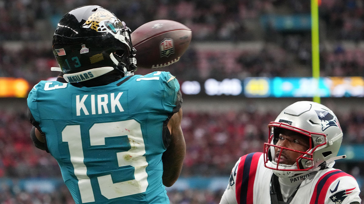 Jacksonville Jaguars wide receiver Christian Kirk (13) attempts to catch the ball against New England Patriots cornerback Marcus Jones (25) in the second half of an NFL International Series game at Wembley Stadium.