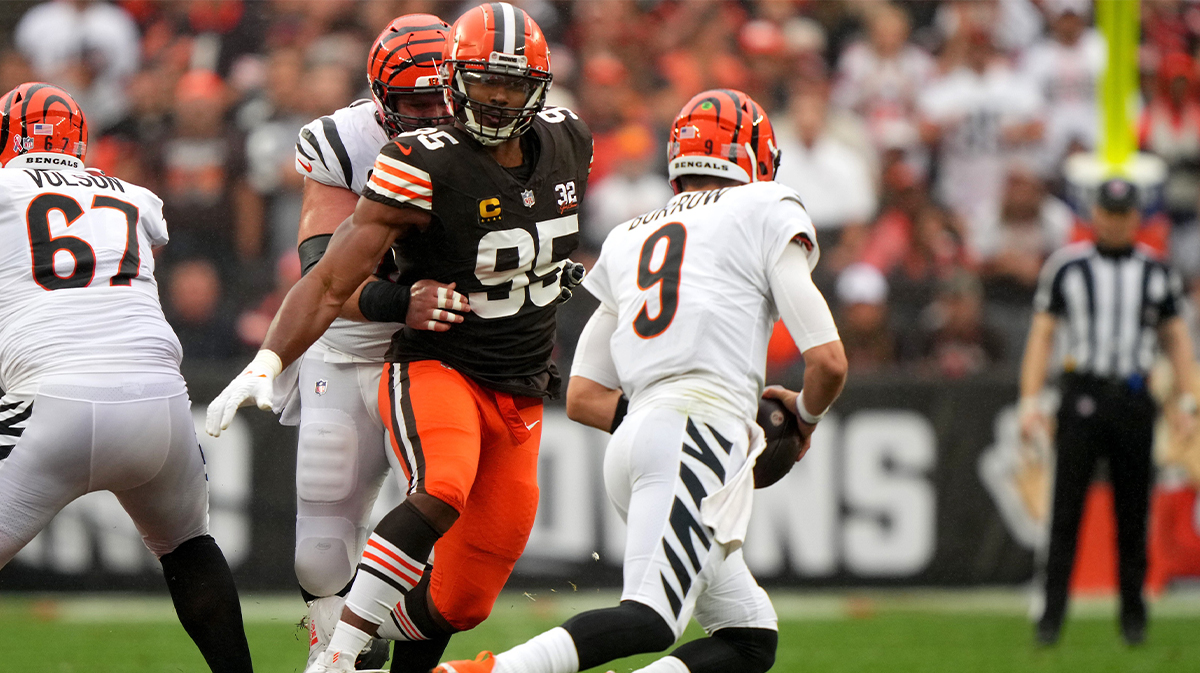 Cleveland Browns defensive end Myles Garrett (95) pressured Cincinnati Bengals quarterback Joe Burrow (9) as Cincinnati Bengals center Ted Karras (64) blocks in the first quarter of an NFL football game between the Cincinnati Bengals and Cleveland Browns, Sunday, Sept. 10, 2023, at Cleveland Browns Stadium in Cleveland.