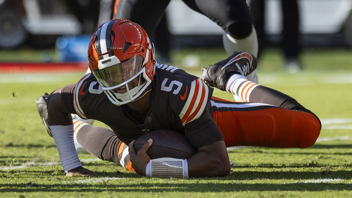 Cleveland Browns quarterback Jameis Winston (5) falls with the ball for a loss of yardage during the fourth quarter against the Cincinnati Bengals at Huntington Bank Field.