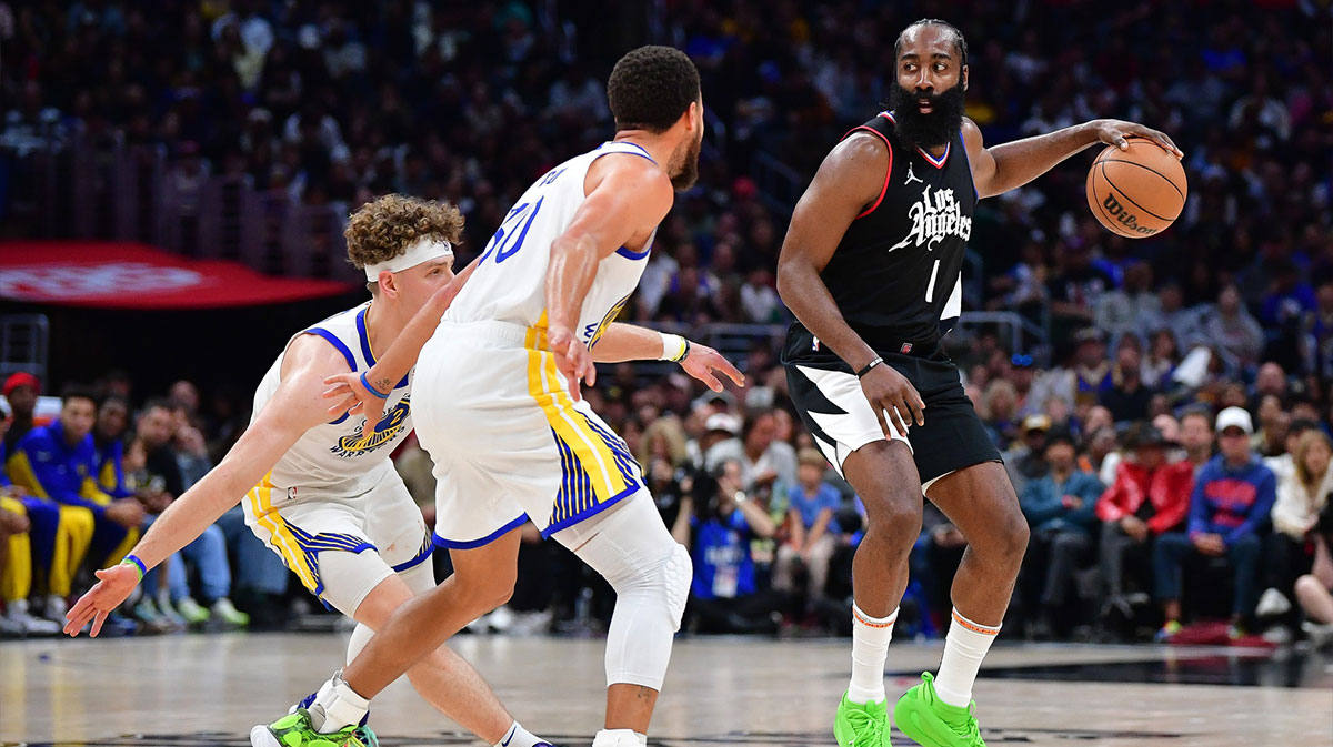 Los Angeles Clippers guard James Harden (1) controls the ball against Golden State Warriors guard Stephen Curry (30) and guard Brandin Podziemski (2) during the second half at Crypto.com Arena