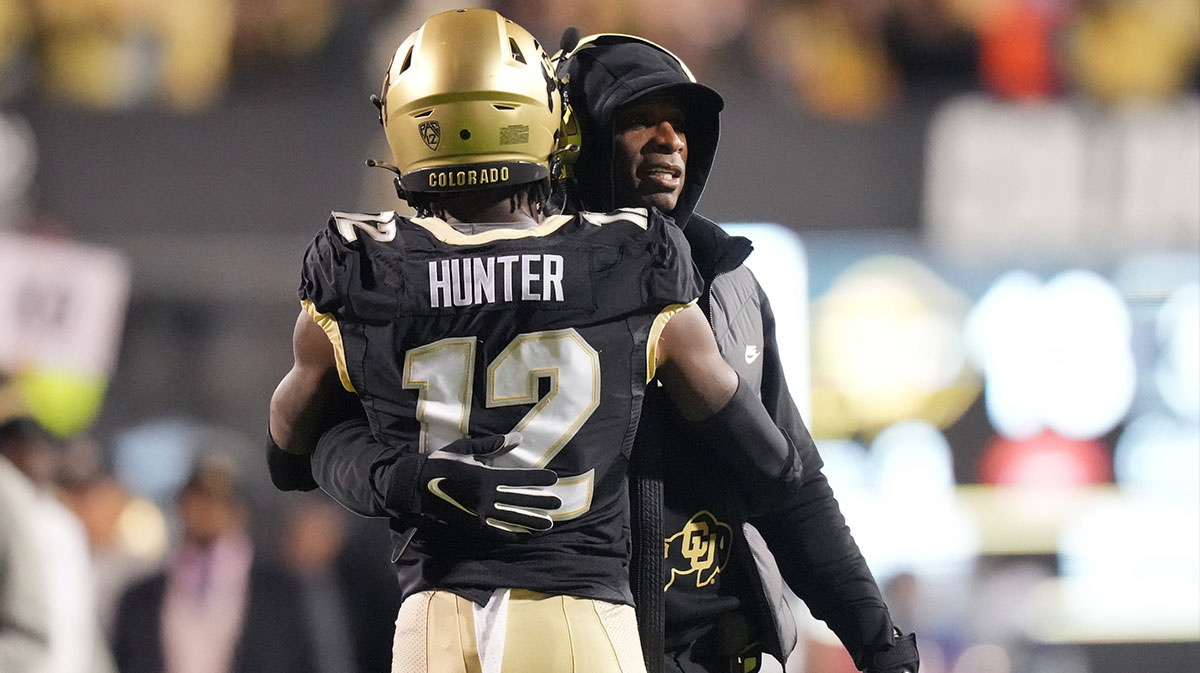 Colorado Buffaloes wide receiver Travis Hunter (12) is congratulated for his touchdown by head coach Deion Sanders in the first quarter against the Stanford Cardinal at Folsom Field