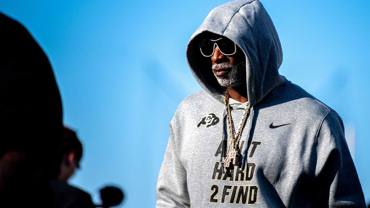 CU football head coach Deion Sanders, or Coach Prime, watches his team warm up before the game against CSU in the Rocky Mountain Showdown at Canvas Stadium