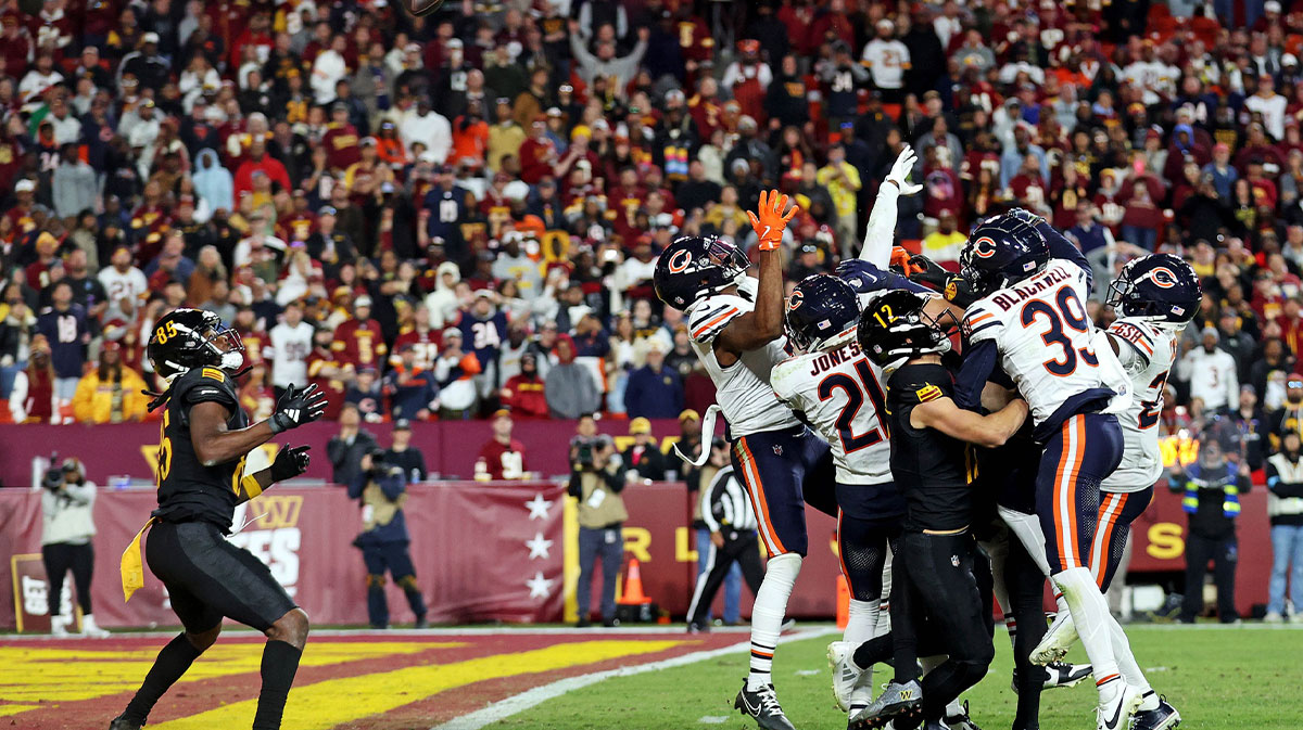 Washington Commanders wide receiver Noah Brown (85) catches a Hail Mary pass that was tipped with no time left to beat the Chicago Bears at Commanders Field.