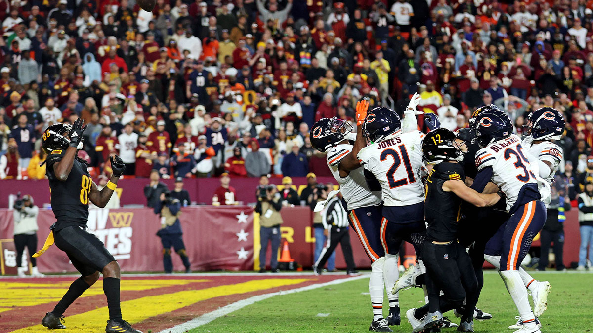 Washington Commanders wide receiver Noah Brown (85) catches a Hail Mary pass that was tipped with no time left to beat the Chicago Bears at Commanders Field.