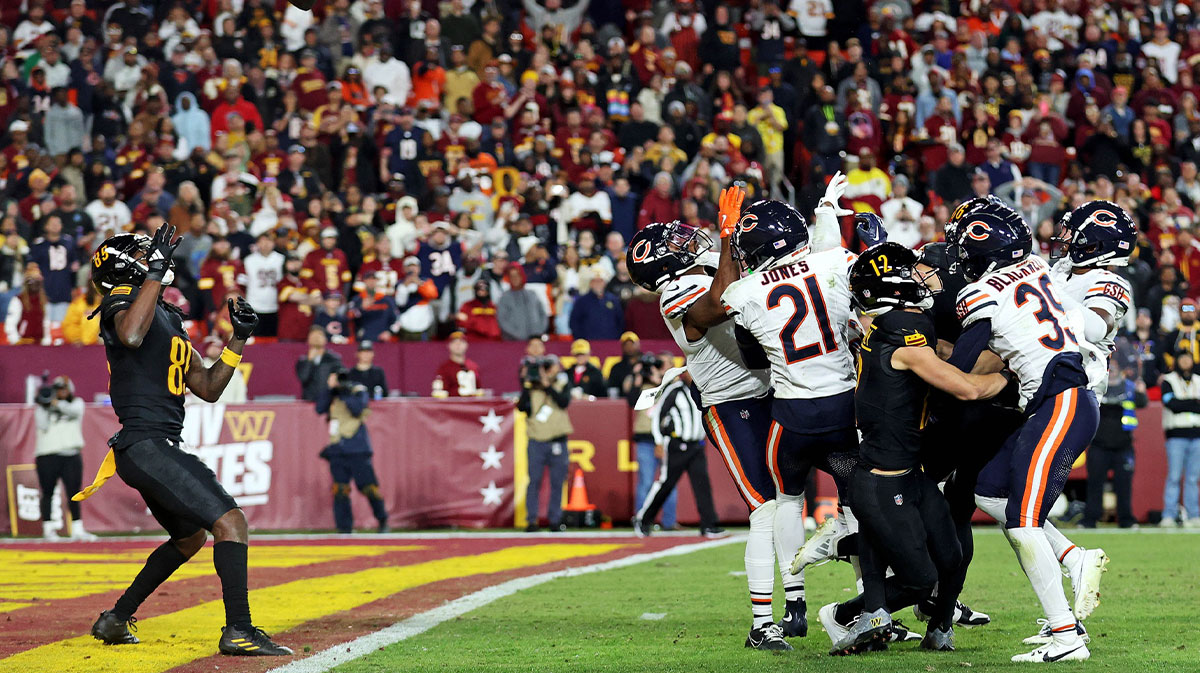 Washington Commanders wide receiver Noah Brown (85) catches a Hail Mary pass that was tipped with no time left to beat the Chicago Bears at Commanders Field.