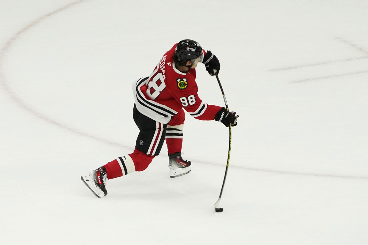 Chicago Blackhawks center Connor Bedard (98) shoots the puck against the Vancouver Canucks during the second period at United Center.