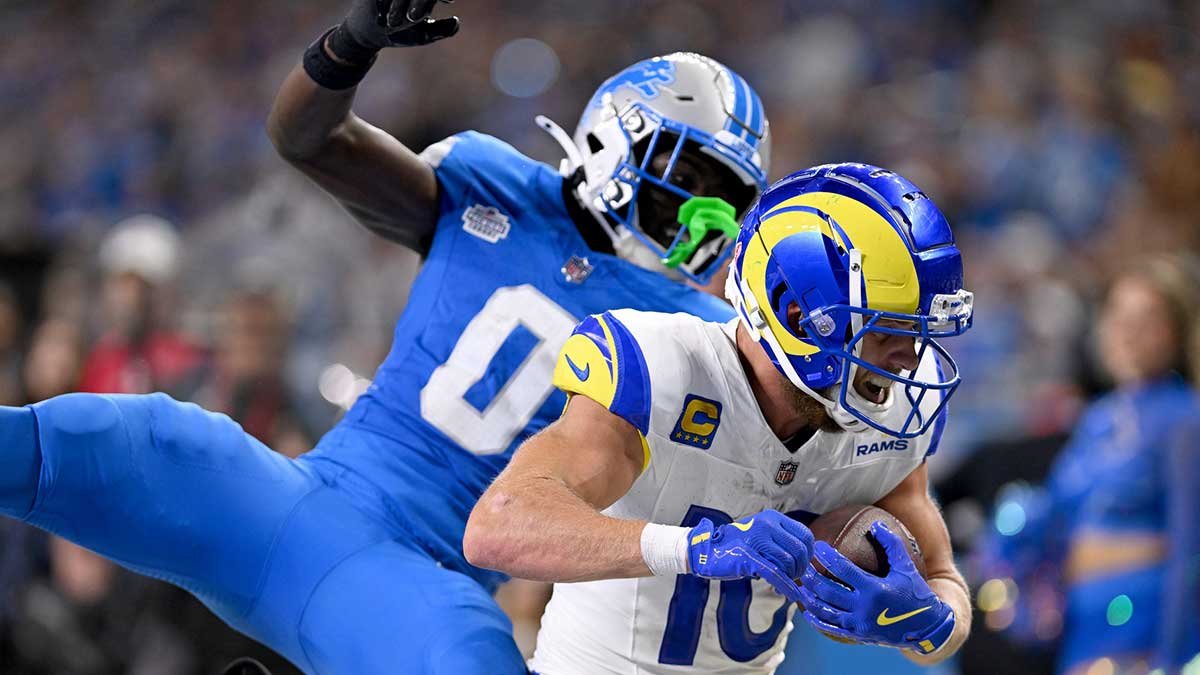 Los Angeles Rams wide receiver Cooper Kupp (10) runs past Detroit Lions cornerback Terrion Arnold (0) to score a touchdown in the fourth quarter at Ford Field.