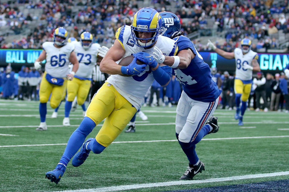 December 31, 2023; East Rutherford, New Jersey, USA; Los Angeles Rams wide receiver Cooper Kupp (10) scores a touchdown against New York Giants cornerback Nick McCloud (44) during the second quarter at MetLife Stadium. 