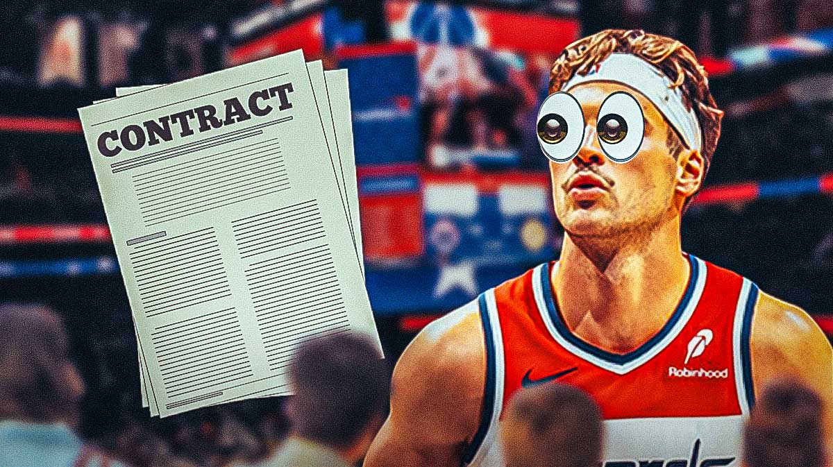 Corey Kispert looks at a contract document with bulging eyes