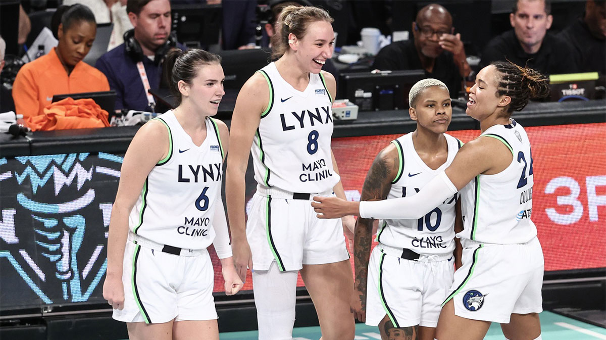 Minnesota Lynx guard Courtney Williams (10) celebrates with her teammates after scoring in the fourth quarter against the New York Liberty at Barclays Center.