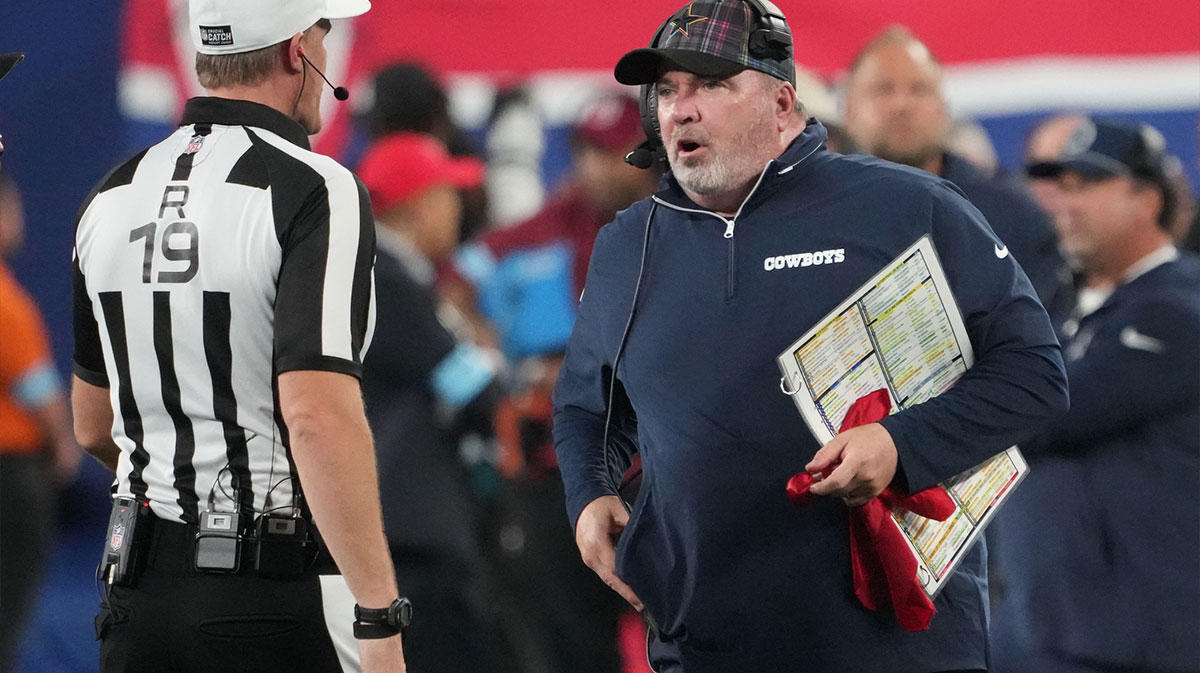 Dallas Cowboys head coach Mike McCarthy and referee Clay Martin (19) talk in th first half against the New York Giants at MetLife Stadium.